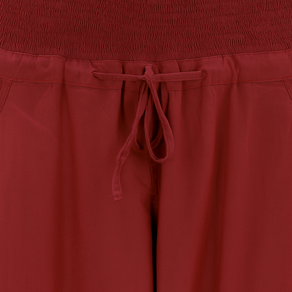 Chikankari-embroidered yoga pants in pomegranate