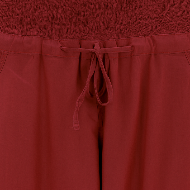 Chikankari-embroidered yoga pants in pomegranate