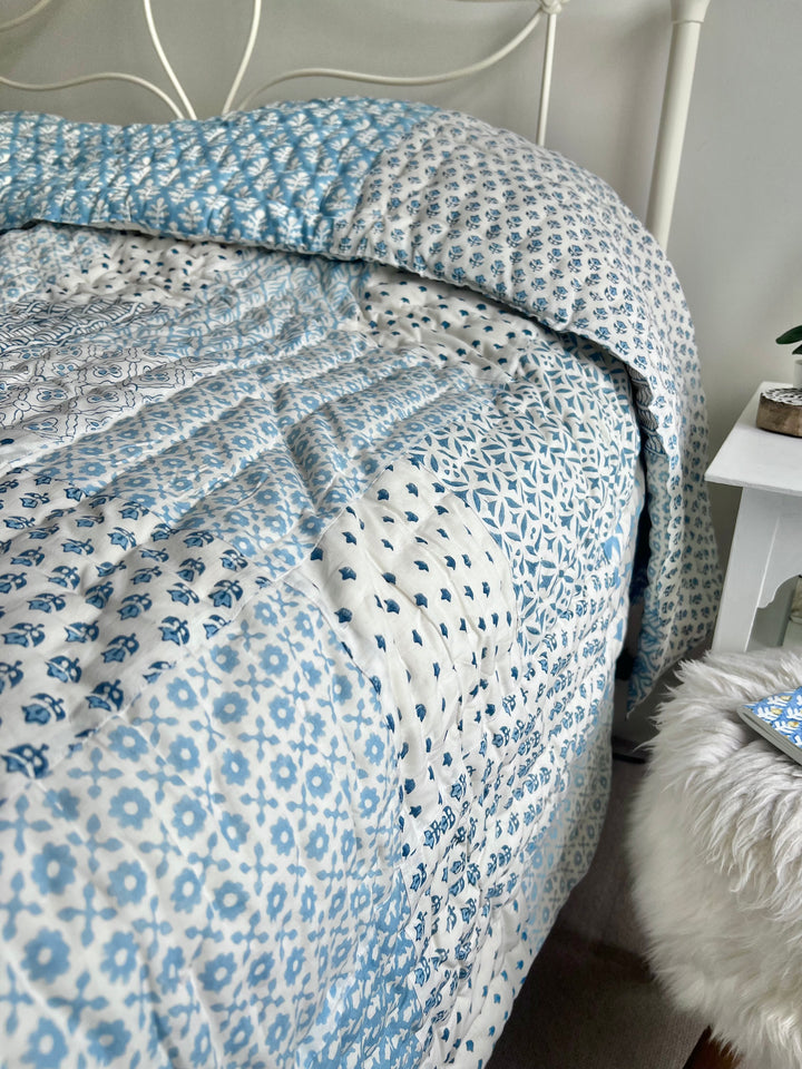 Heirloom patchwork quilt in dusty blue