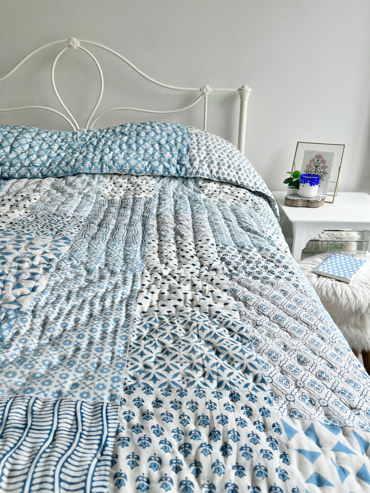 Heirloom patchwork quilt in dusty blue