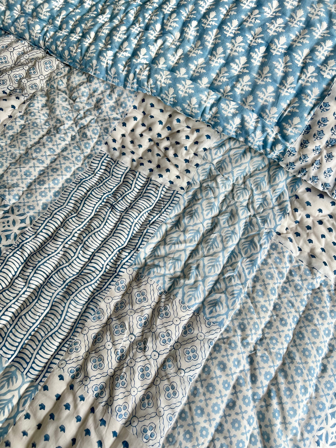 Heirloom patchwork quilt in dusty blue