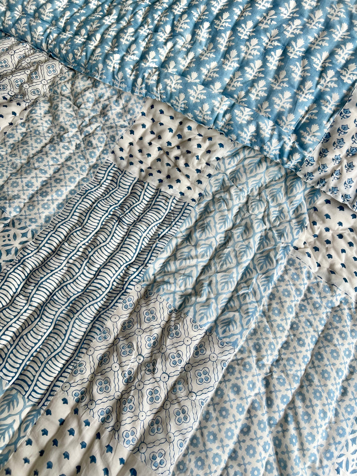 Heirloom patchwork quilt in dusty blue