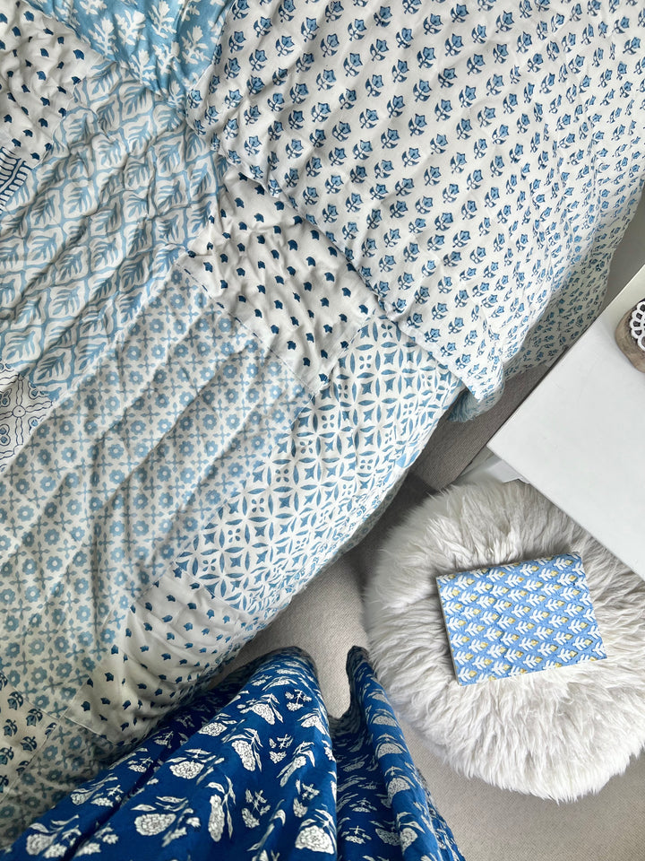 Heirloom patchwork quilt in dusty blue