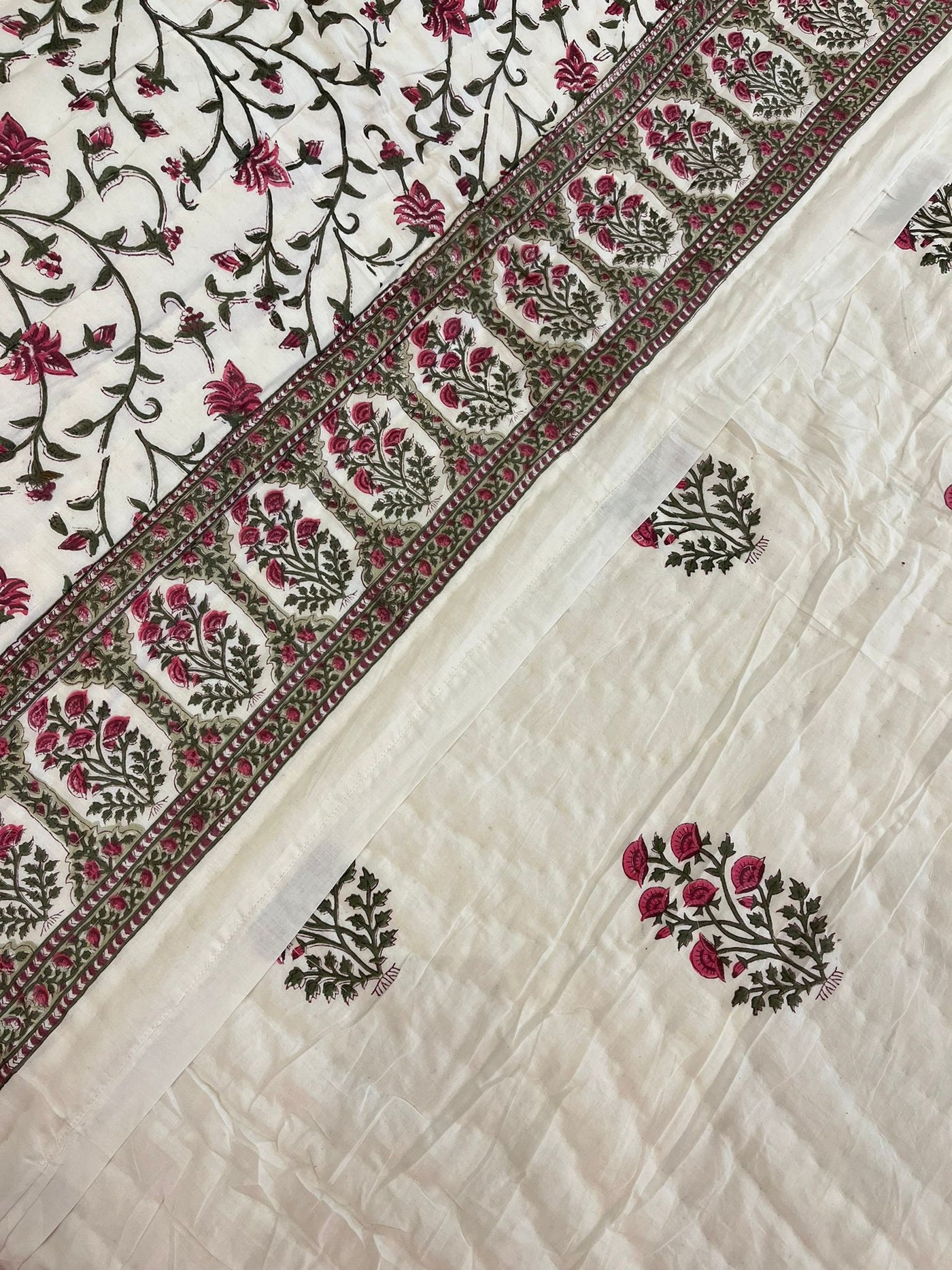 Jasmine Jaal hand-block printed quilt in sage and pink